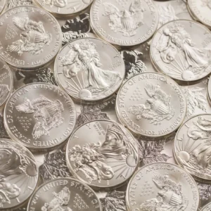 Shiny silver coins with detailed engravings